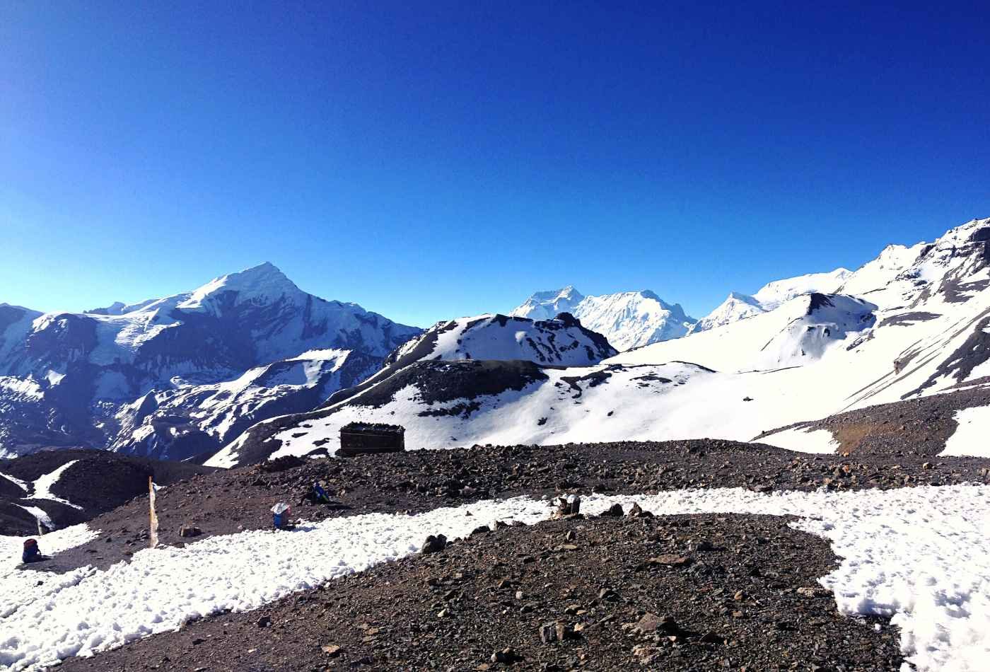 A panoramic view of the Chu-East and Chu-West mountain ranges, as seen on the way from Thorong La Pass during the Annapurna Circuit trek.