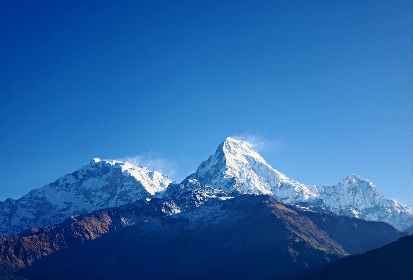 Annapurna Fang, Annapurna South, and Hiunchuli standing tall with snowly summit and blue sky from Poon Hill. 