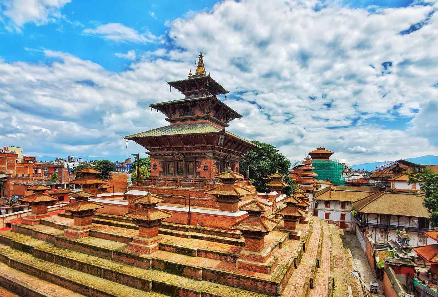 A beautiful view of the Taleju Temple, located in Kathmandu Durbar Square, with a clear blue sky in the background.