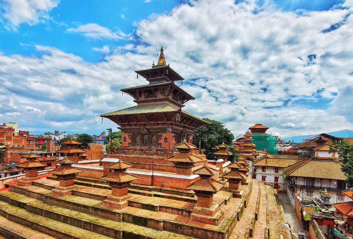 A beautiful view of the Taleju Temple, located in the Kathmandu Durbar Square, with a clear blue sky in the background.
