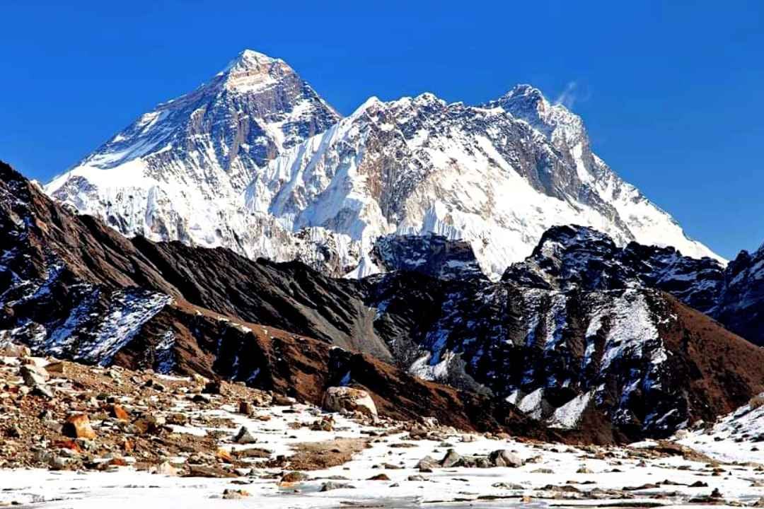Mountain range view from Kongma-la pass in Khumbu Region, with Mt. Everest, Nuptse and Lhotse visible in the distance on a clear day.