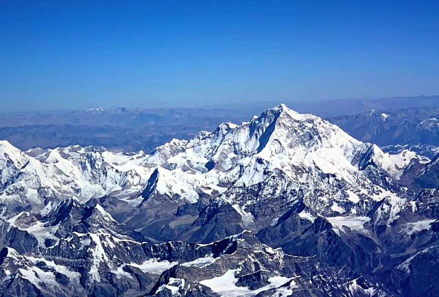 View of majestic Himalayan peaks including Mt. Everest, as seen from a plane while flying to Bhutan.