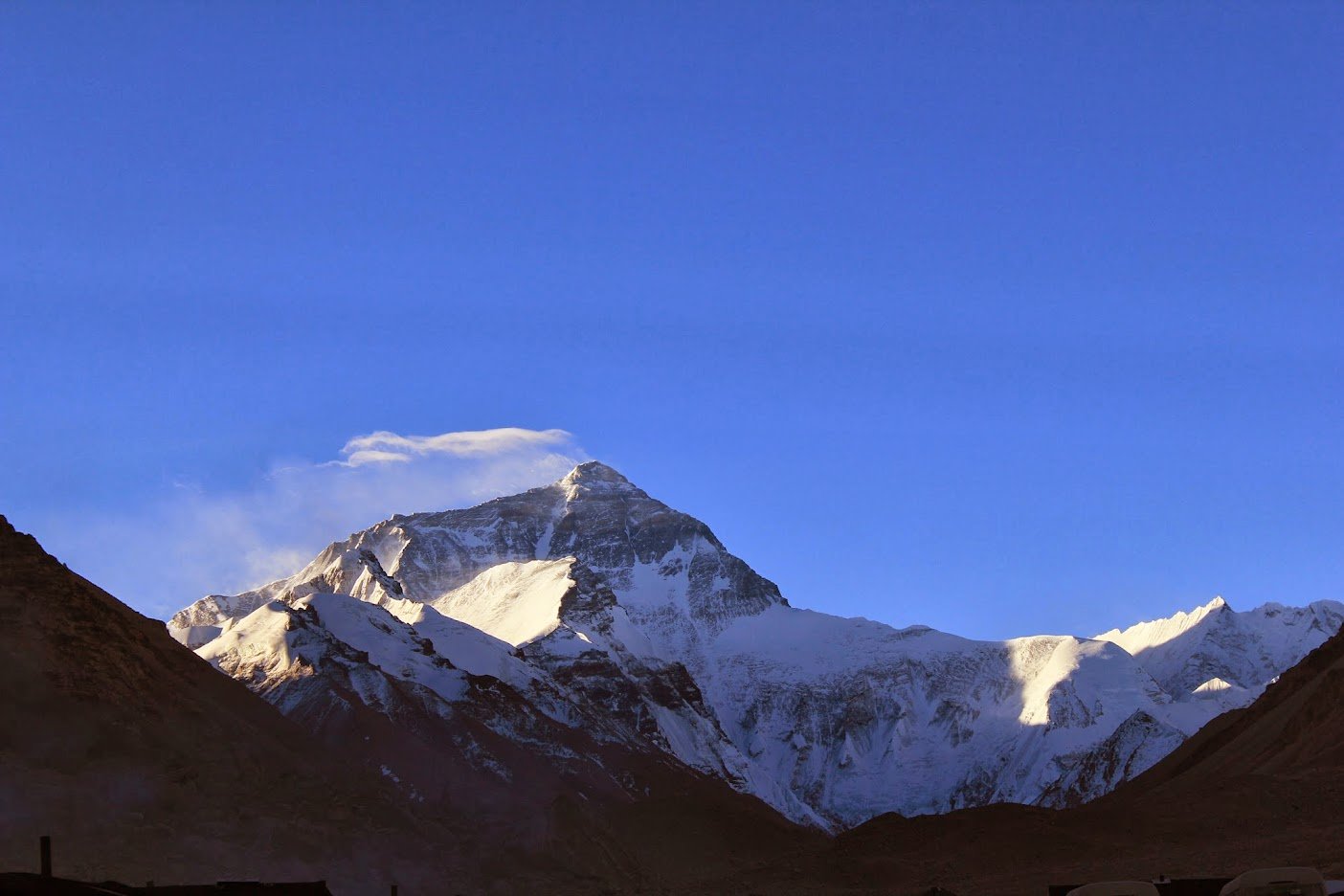 Mt. Everest image with clouds and blue sky from Everest Base Camp in Tibet.