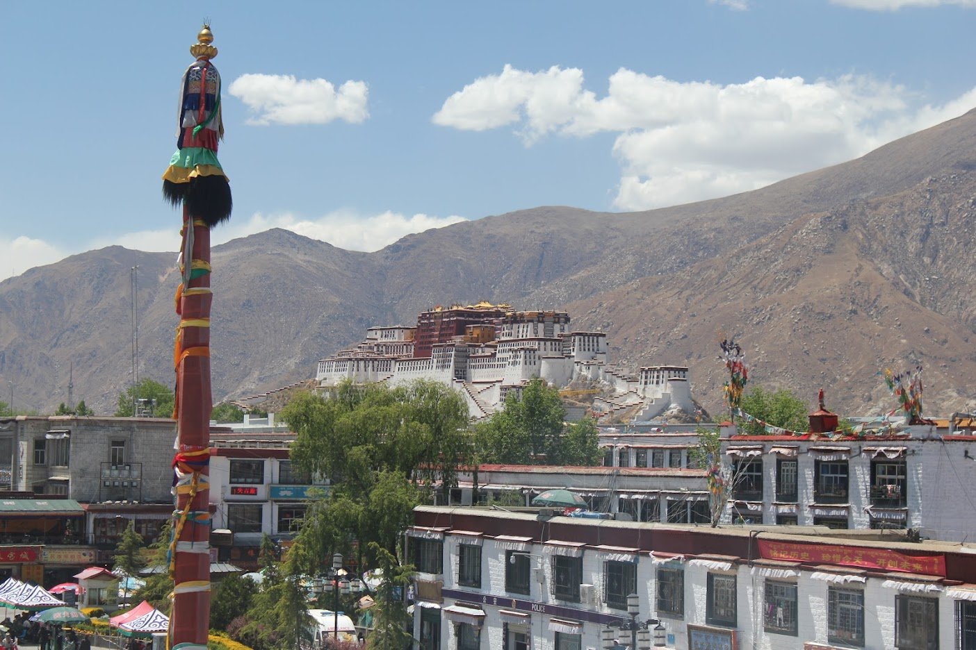 View of the Potala Palace from the hotel window, with the green trees in front side.